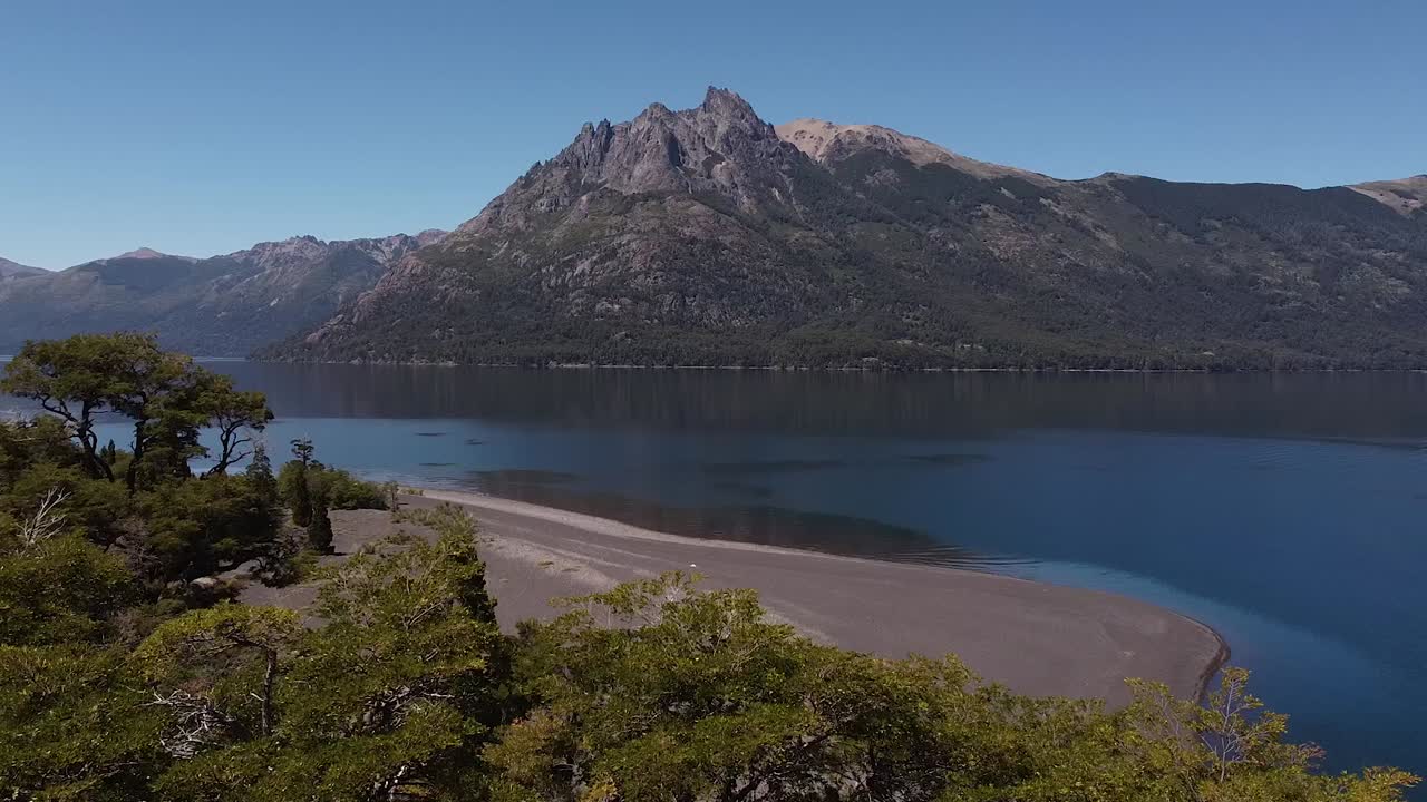 Revealing aerial of the lake and water banks in the mountains of Patagonia, Argentina, South America