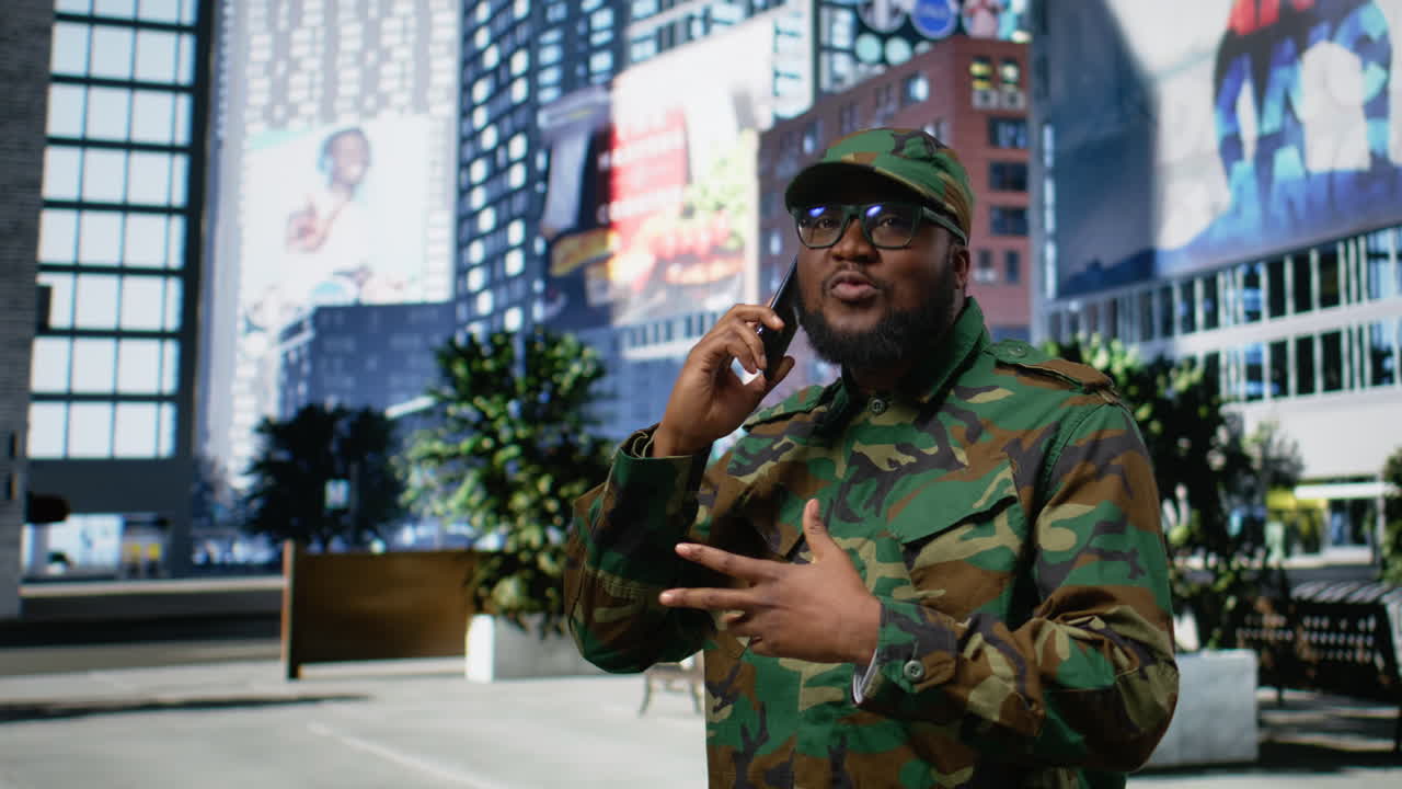 Black soldier in uniform answering phone call from his superior