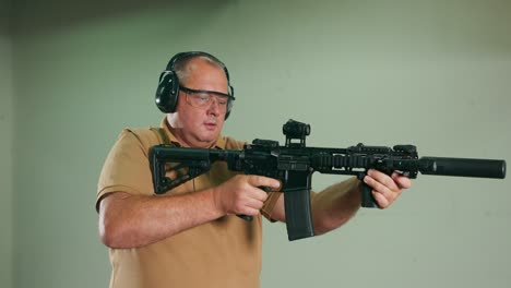 the stressed student fires the first shot from the rifle at the shooting range