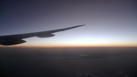 sunrise or sunset view from airplane window