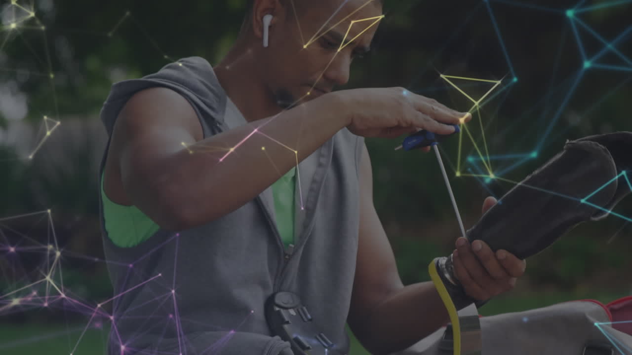 animación de la red de comunicación sobre el atleta masculino ajustando la pierna protésica para el ejercicio al aire libre