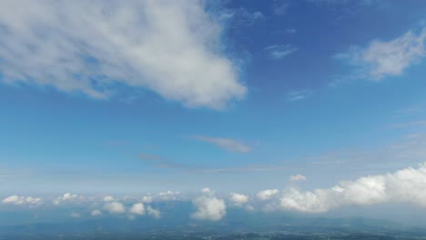 Blue-sky-and-fluffy-clouds-landscape-background,-cloudscape-aerial-view