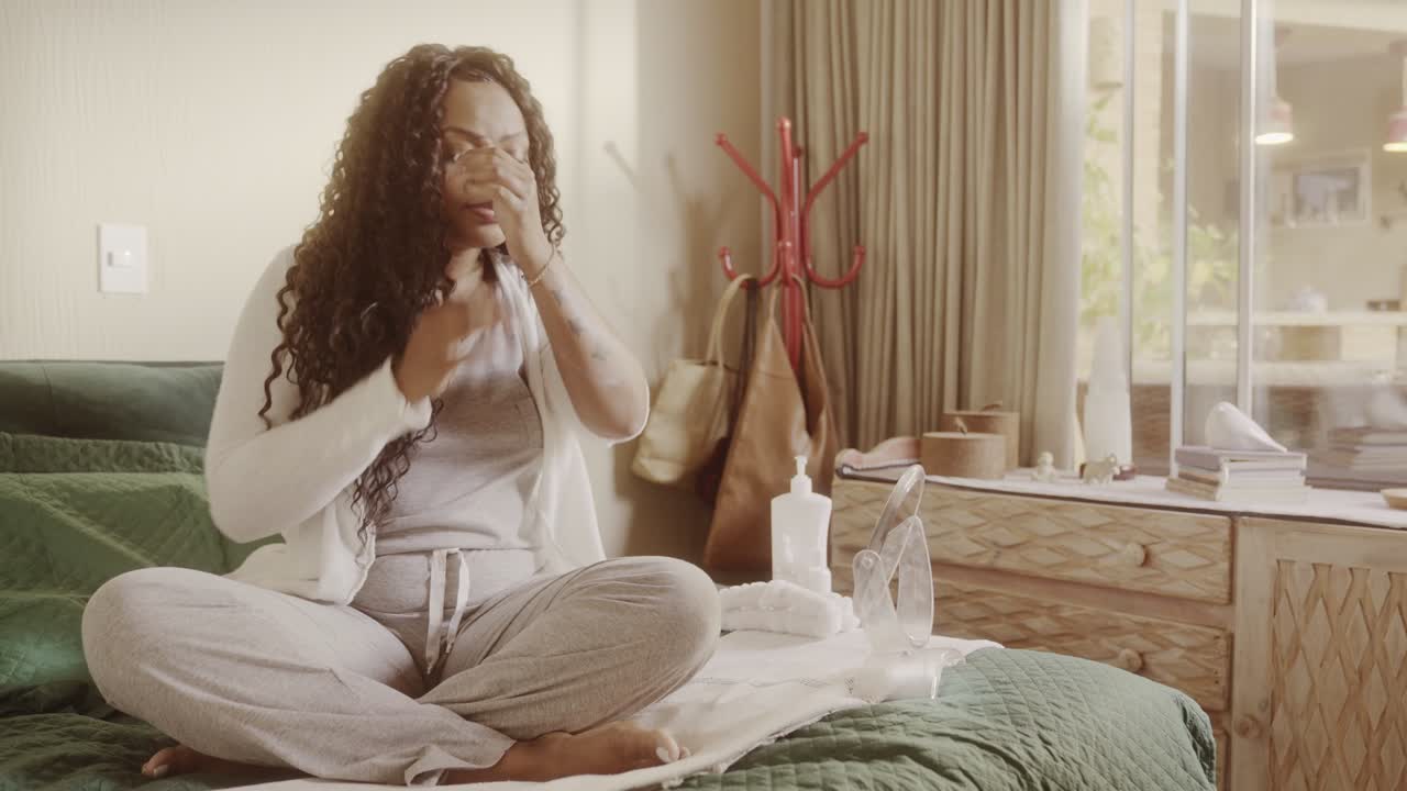 Woman's daily skincare routine in a cozy bedroom setting