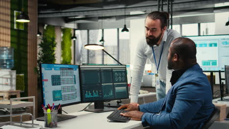 vertical video administrator and assistant gather data from monthly reports