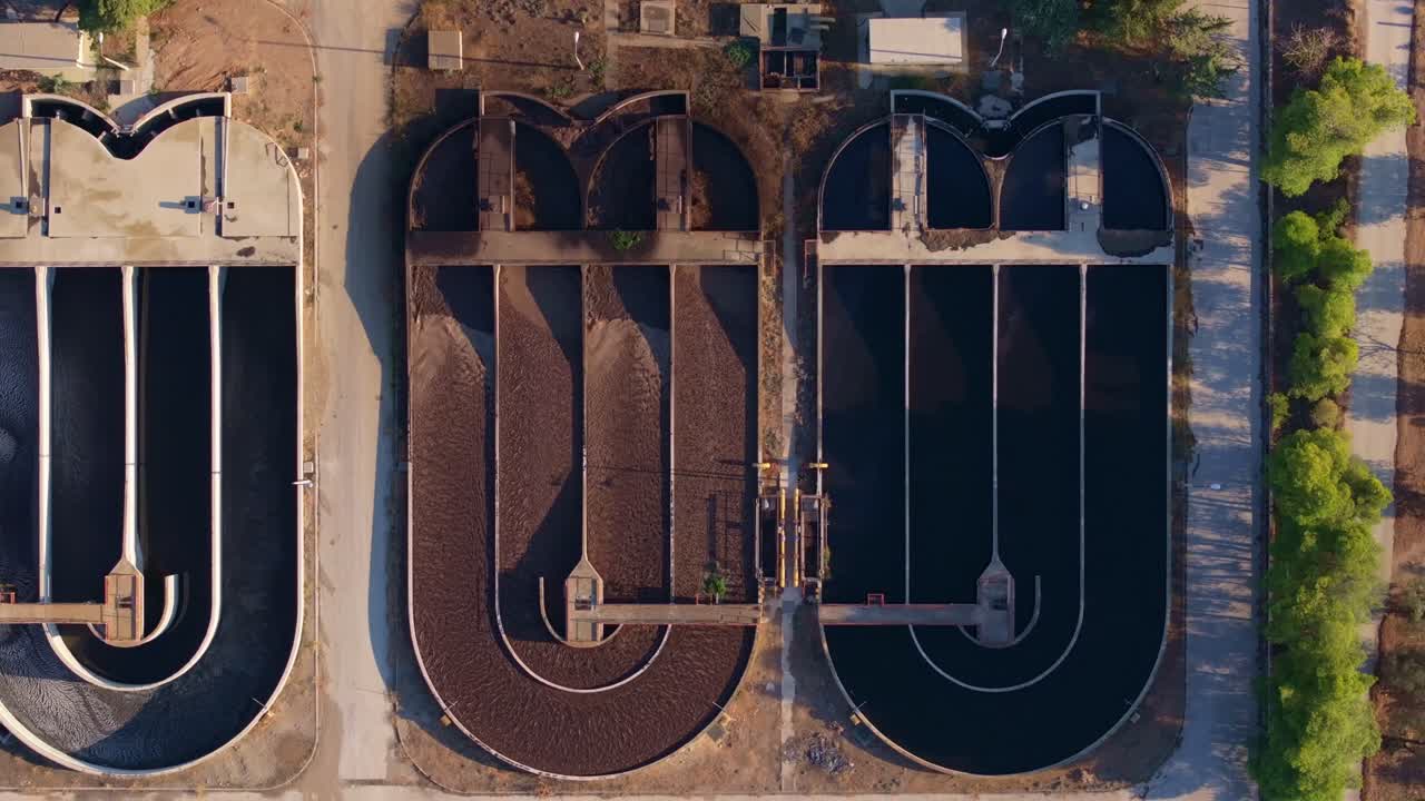 Aerial view of sleek water processing facility with greenery, Corinth, Greece