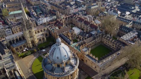 university of oxford, sweeping aerial reveal passing the church of saint mary the virgin and the radcliffe camera library