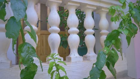 white coloured concrete pillars on balcony fence