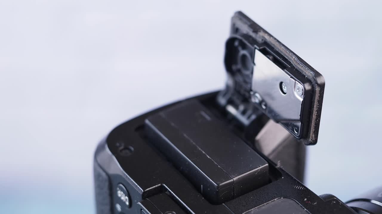 Hand operating a camera