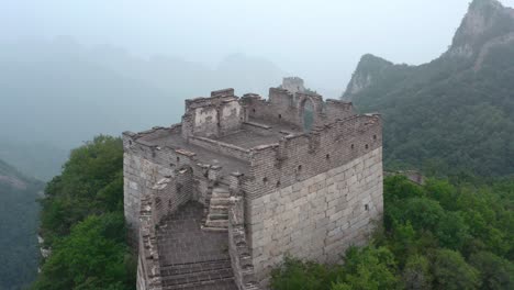 view of old lookout tower of great wall of china, on foggy day