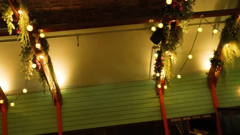 empty restaurant with neon lights and hanging plants