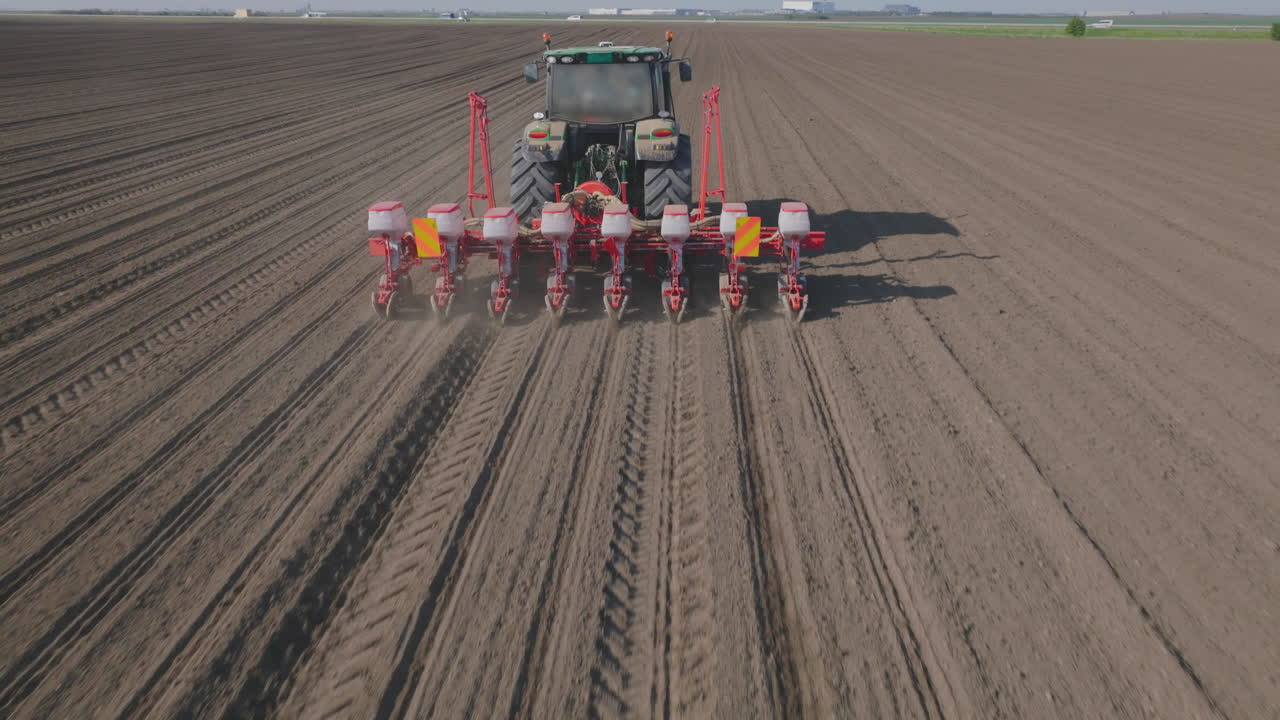 Agricultural Machinery Planting Seeds in Field