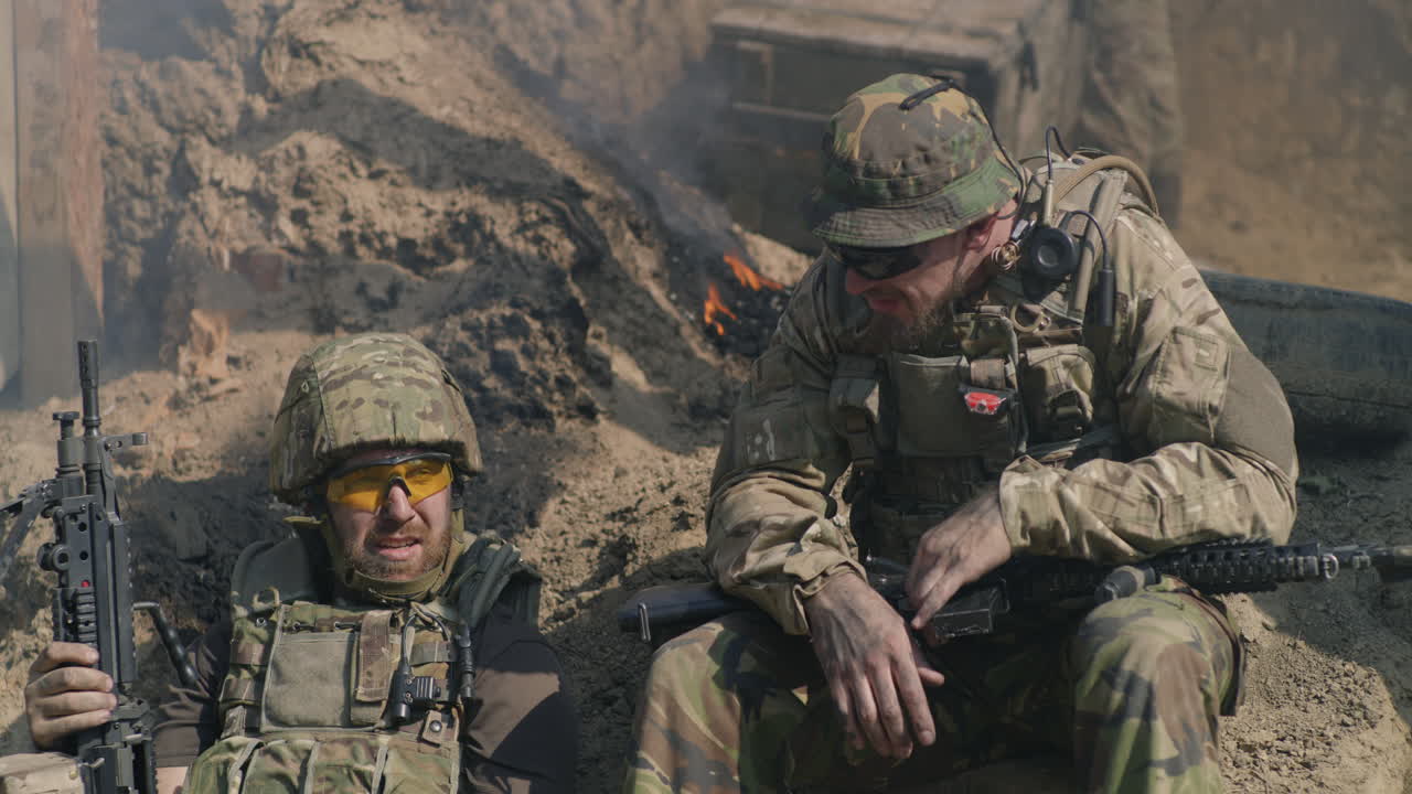 Two Soldiers Resting on Battlefield