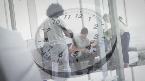 animation of clock moving over diverse colleagues discussing work in office