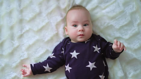 baby in a star-print onesie