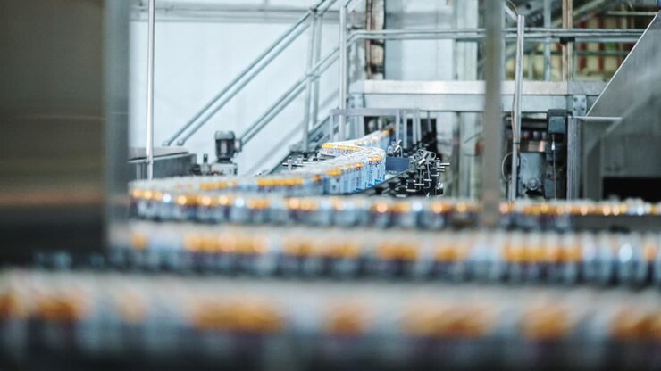 Soda pop beverage cans moving through a factory