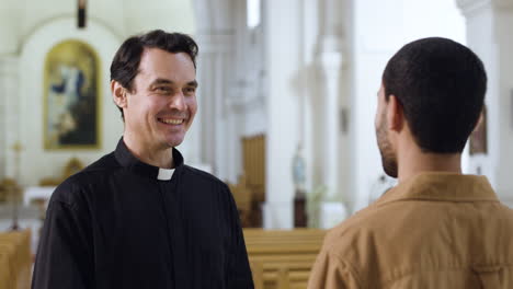 Two-men-talking-indoors