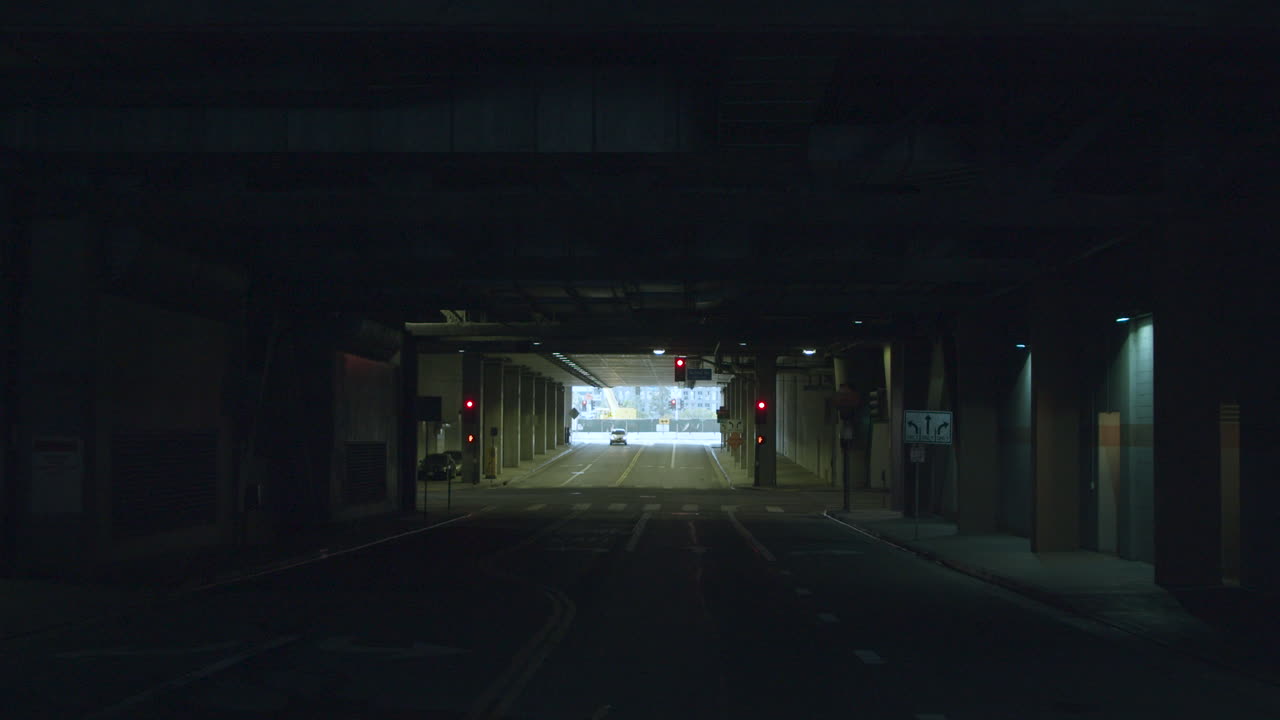 Navigating a Dark Urban Tunnel with Red Traffic Lights