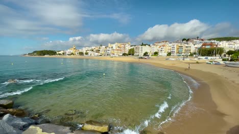 Platja-de-les-Barques-sea-field-Maresme-Barcelona-Mediterranean-coast-plane-close-to-turquoise-blue-transparent-water-beach-without-people