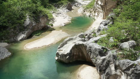 tourist walking through tranquil nizao river