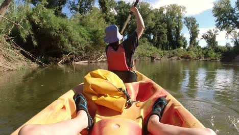 funny hyperlapse of woman paddling a kayak along the river ter in catalonia spain