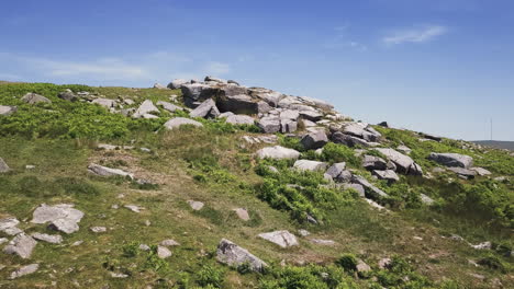 wide aerial dolly forward of the granite rocks in dartmoor national park, england