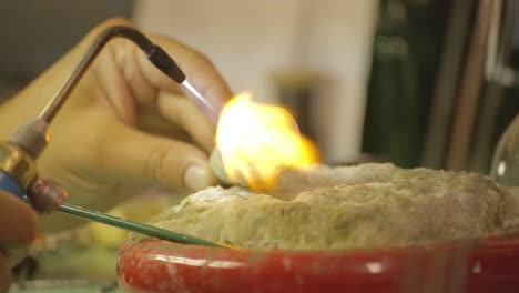 italian goldsmith at work building an engagement or a wedding ring