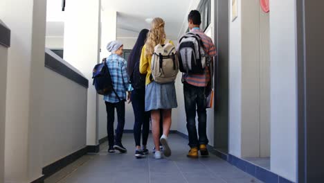 Group-of-classmate-walking-in-corridor