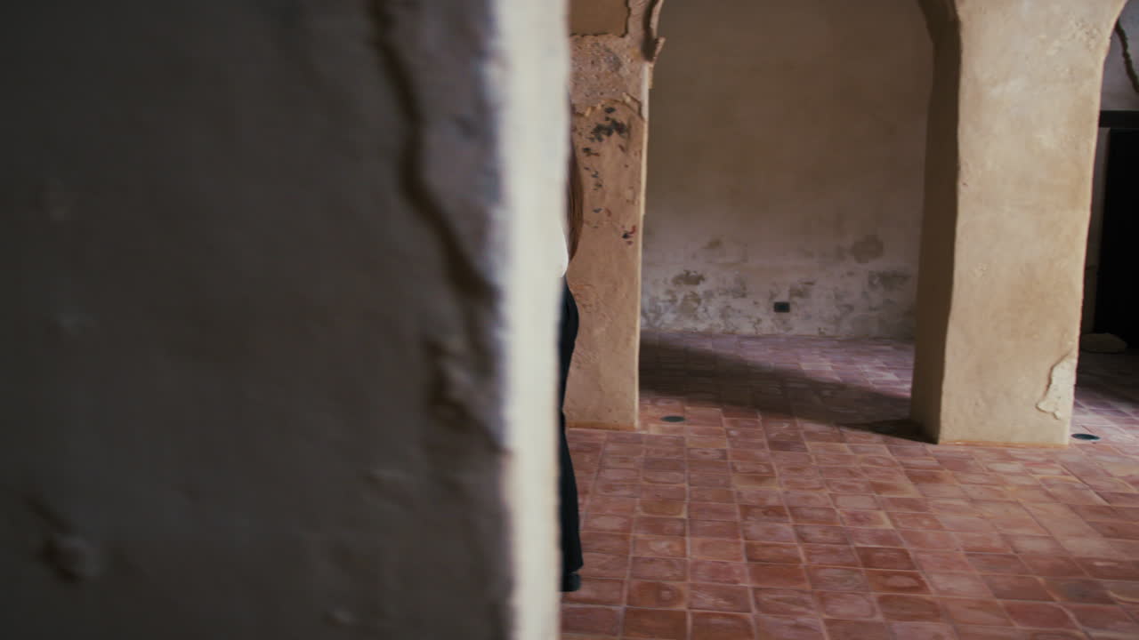 Woman Entering And Walking Inside The Small Old Church