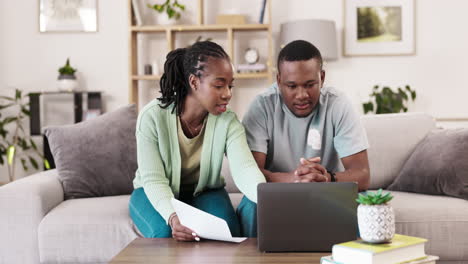 Bills,-couple-and-laptop-with-paper-on-sofa