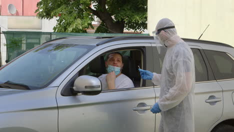 medical worker taking a sample from nose