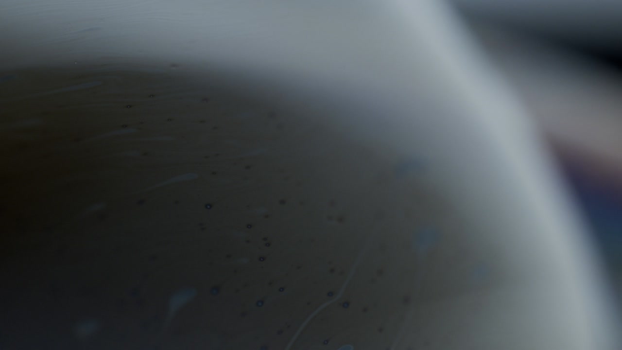 Macro Shot of Transluscent Surface of Soap Bubble and Little Bubbles in Area