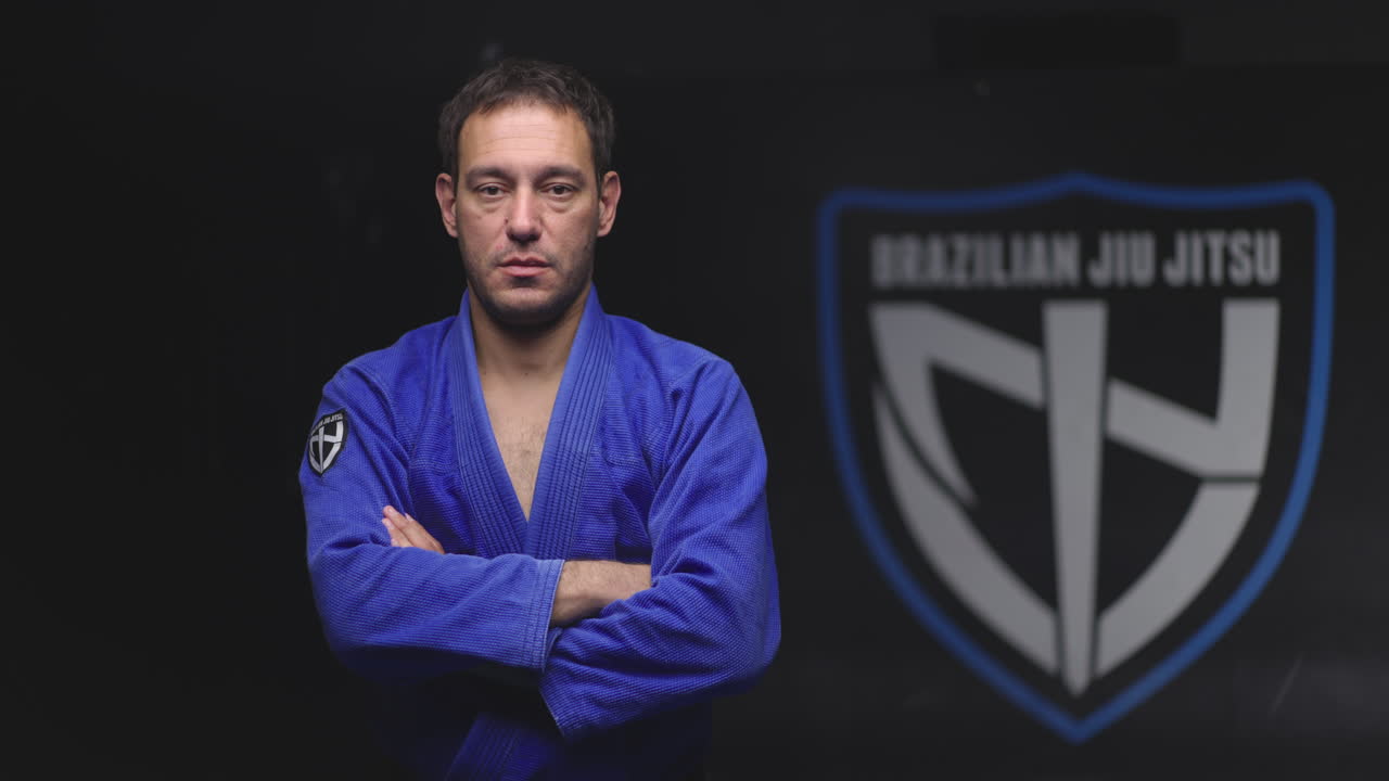 Man in blue Gi for Brazilian Jiu Jitsu