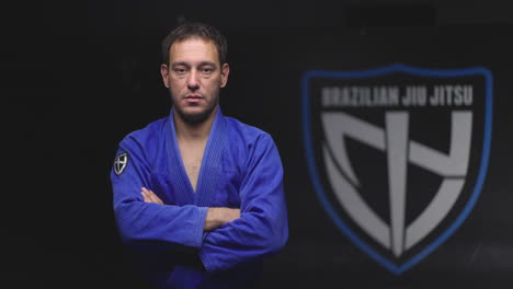 man in blue gi for brazilian jiu jitsu