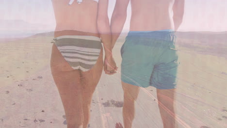 couple walking on sandy beach wearing bikini bottoms and swim shorts, with animated marketing chart