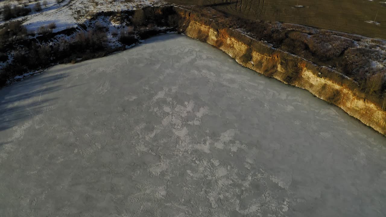 Flying upwards and above the quarry during winter