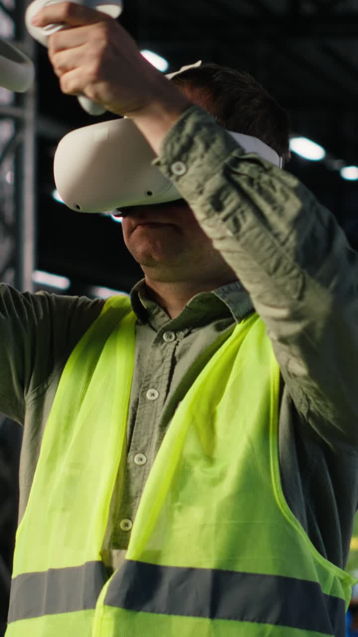 Vertical Video Industrial worker with VR glasses interacting with virtual reality simulation