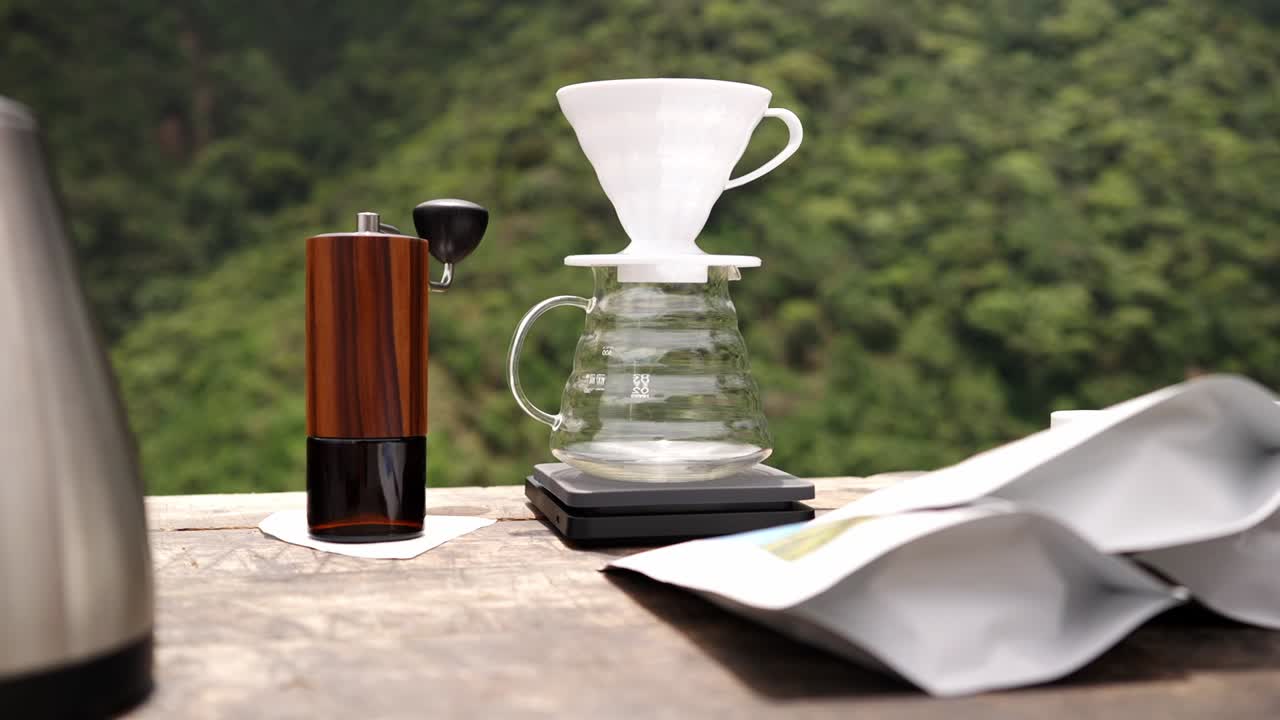 Dolly view of a V60 coffee jar in the nature during daylight.