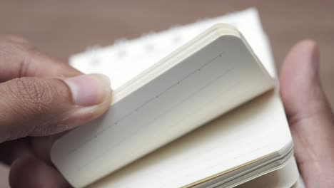 person holding an open notebook