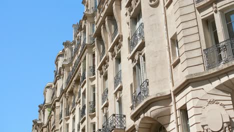 typical parisian building with balconies and windows