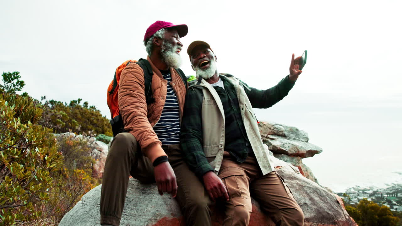 Older men taking selfie on a hike
