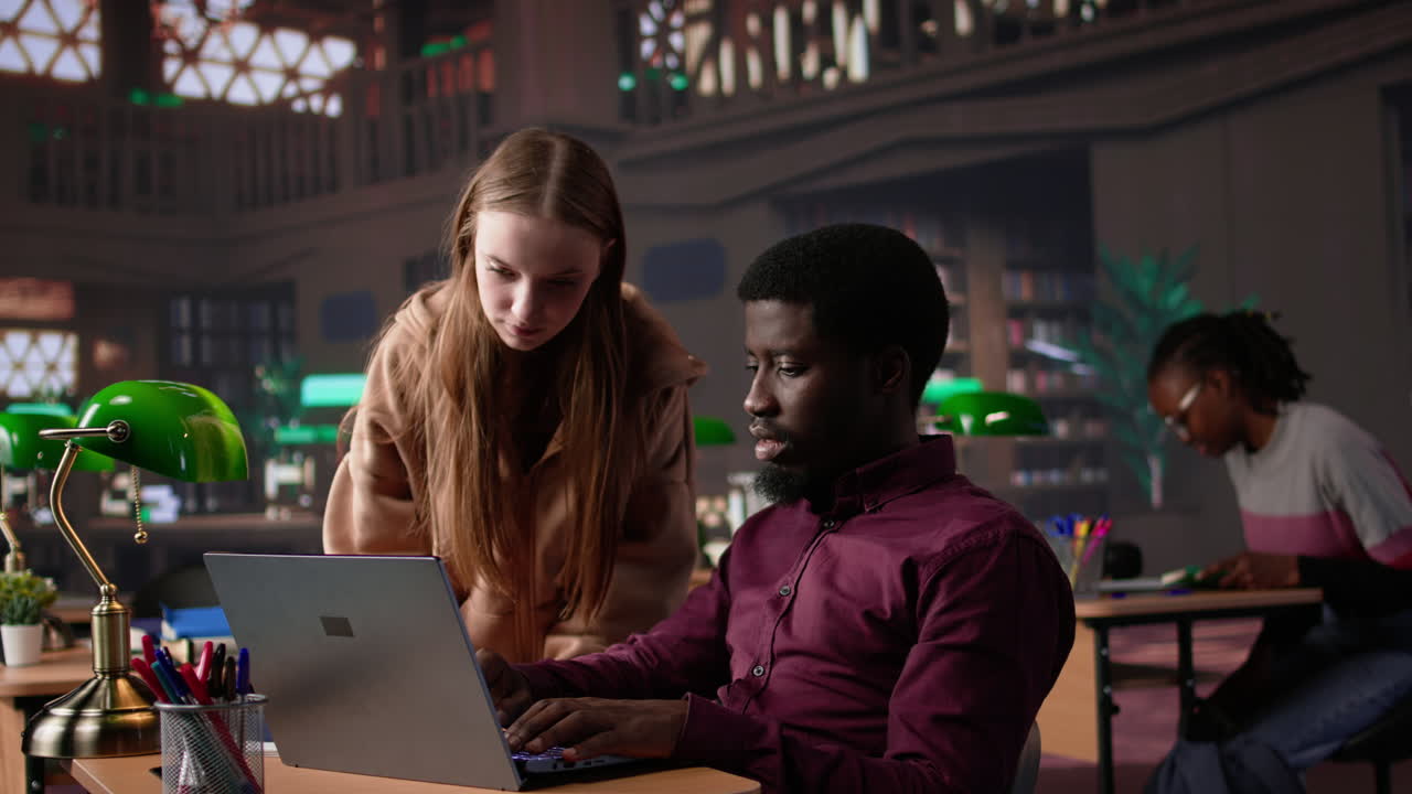 Vertical video multiethnic pupils working on team project assignment at campus library