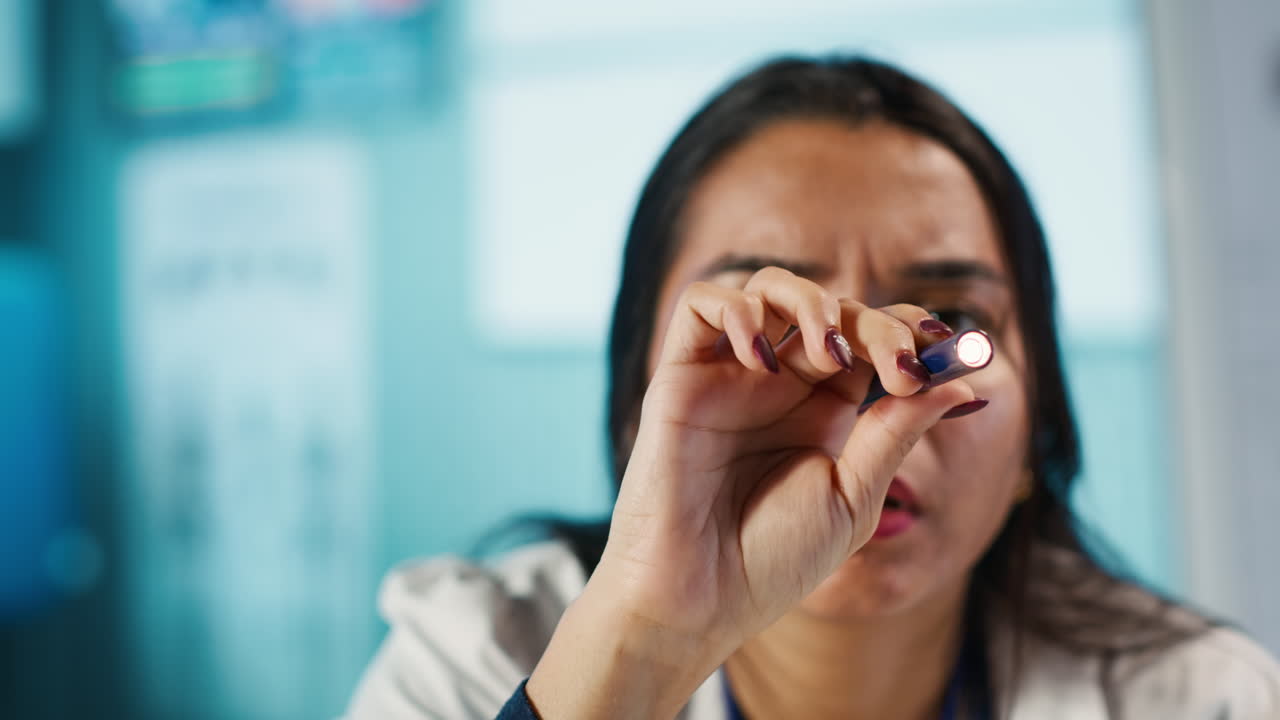 Doctor examining a pill
