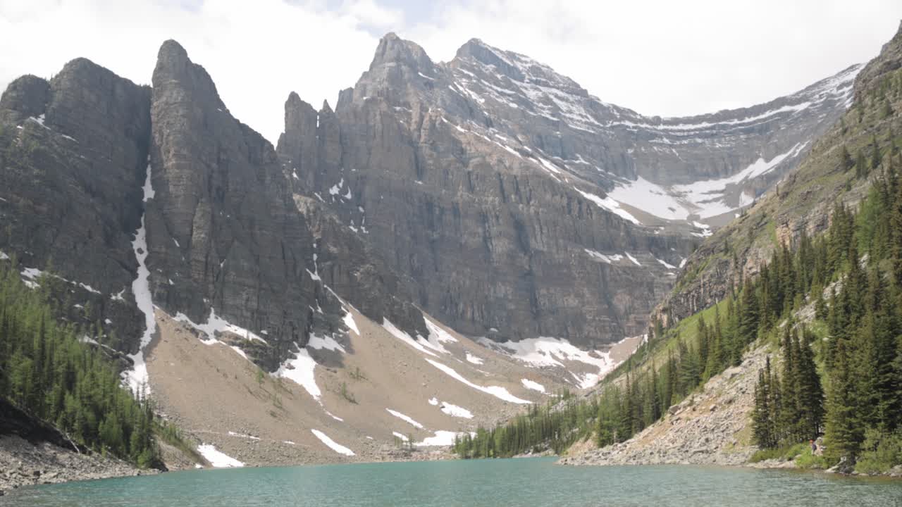 Beautiful view lake Agnes and a mountain range in the background from the Lake Agnes Tea House on Mount St. Piran and Mount Whyte, within Banff National Park near Lake Louise Alberta.