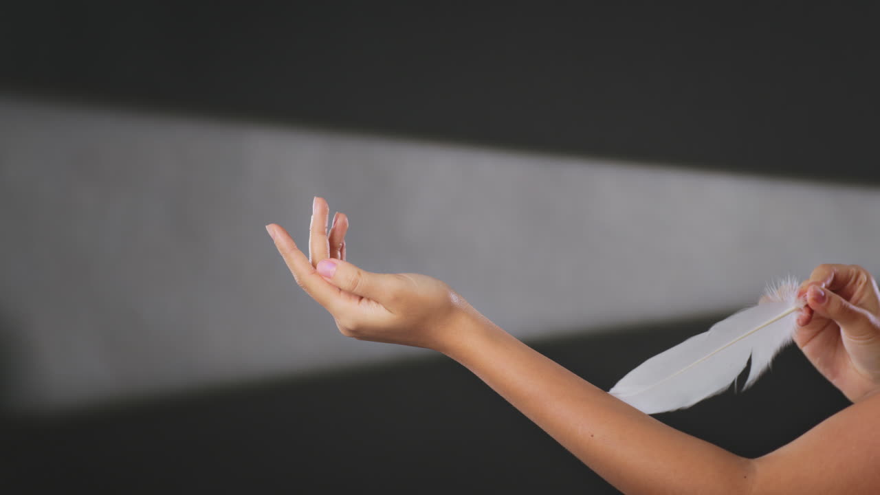 Woman holding a feather