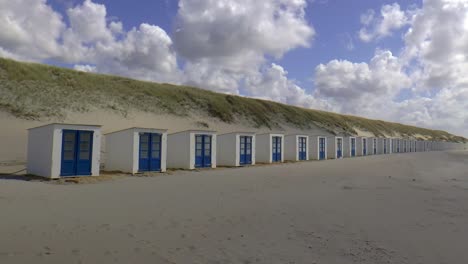 small beach houses on the beach of texel