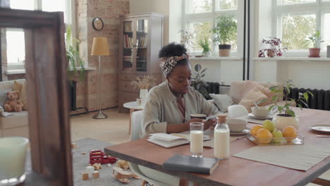slowmo of black woman resting in loft apartment