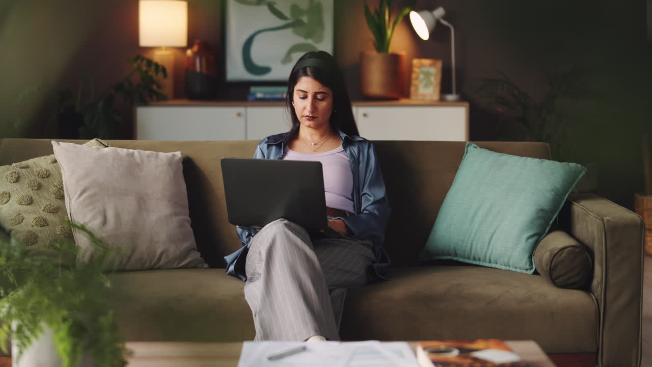 Woman working on laptop at home