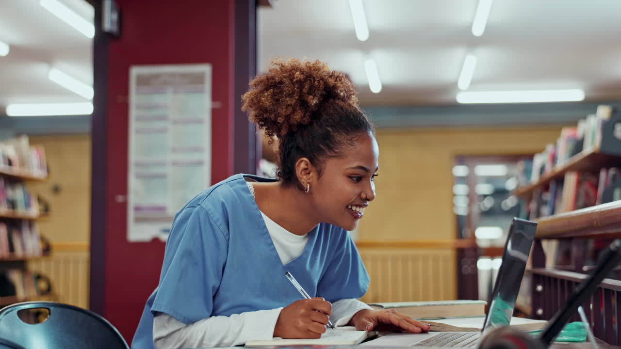 A woman studying in the library