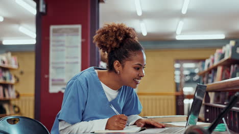 a woman studying in the library