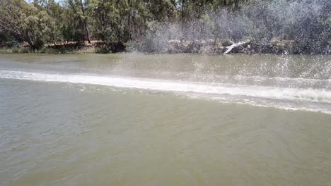 Drone-aerial-over-river-someone-water-skiing